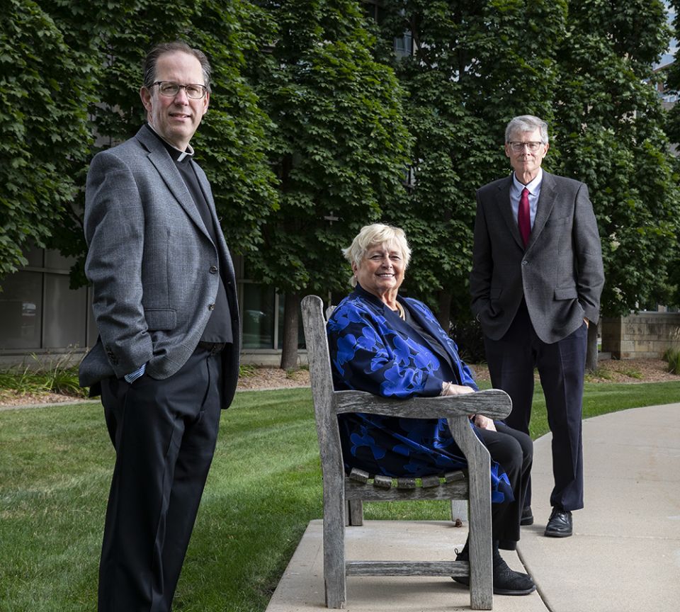 Fr. Daniel Griffith, left, and Hank Shea, right, are pictured with Janine Geske, a former Wisconsin Supreme Court Justice. (Mark Brown/University of St. Thomas)
