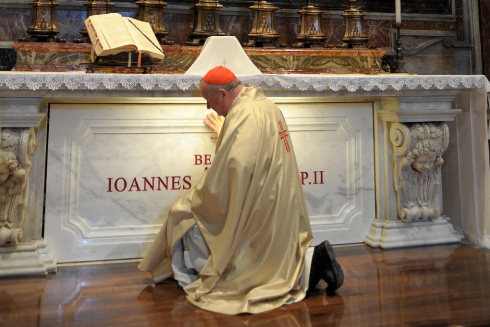 Polish Cardinal Stanislaw Dziwisz prays at the tomb of St. John Paul II in St. Peter's Basilica at the Vatican in May 2011. (CNS/L'Osservatore Romano) Polish Cardinal Stanislaw Dziwisz prays at the tomb of St. John Paul II in St. Peter's Basilica at the Vatican in May 2011. (CNS/L'Osservatore Romano)
