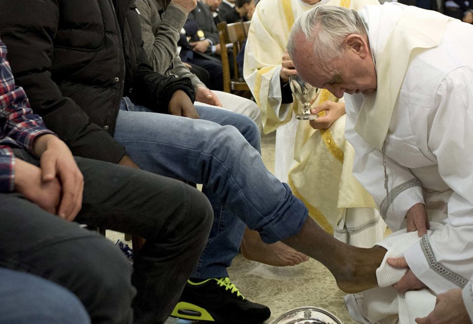 Pope Francis washes the foot of a prison inmate during the Holy Thursday Mass of the Lord's Supper at Rome's Casal del Marmo prison for minors March 28, 2013. (CNS/Reuters/L'Osservatore Romano)
