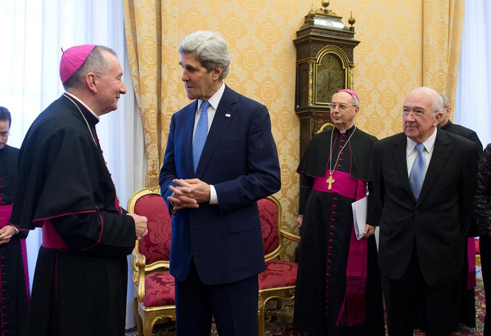In January 2014, then-Cardinal-designate Pietro Parolin, Vatican secretary of state, meets with his U.S. counterpart in the Obama administration, John Kerry, at the Vatican. At right is Ken Hackett, then U.S. ambassador to the Holy See. (CNS) In January 2014, then-Cardinal-designate Pietro Parolin, Vatican secretary of state, meets with his U.S. counterpart in the Obama administration, John Kerry, at the Vatican. At right is Ken Hackett, then U.S. ambassador to the Holy See. (CNS)