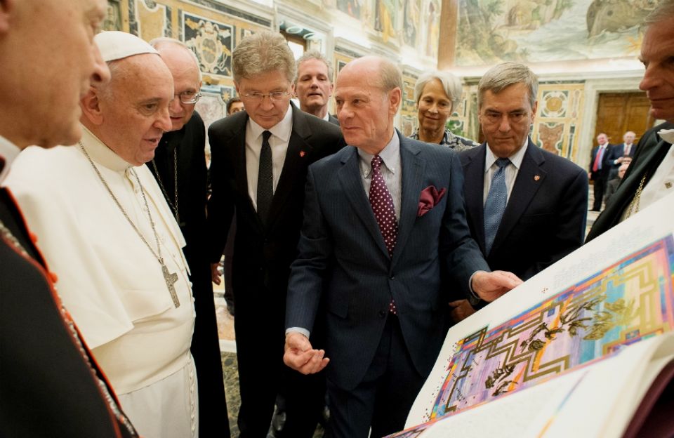 Pope Francis accepts the final volume of The St. John's Bible at the end of an audience with the Papal Foundation at the Vatican in April 2015. (CNS/L'Osservatore Romano) Pope Francis accepts the final volume of The St. John's Bible at the end of an audience with the Papal Foundation at the Vatican in April 2015. (CNS/L'Osservatore Romano)