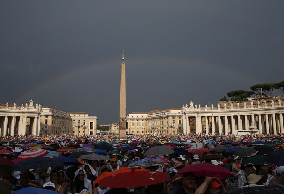 A rainbow is seen as Pope Francis attends a meeting with Catholic charismatics in St. Peter's Square July 3, 2015, at the Vatican. (CNS/Paul Haring) A rainbow is seen as Pope Francis attends a meeting with Catholic charismatics in St. Peter's Square July 3, 2015, at the Vatican. (CNS/Paul Haring)