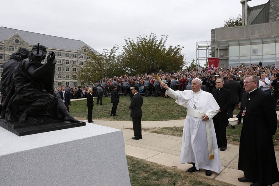 At St. Joseph's University in Philadelphia Sept. 27, 2015, Pope Francis blesses a sculpture commemorating the 50th anniversary of "Nostra Aetate," the Second Vatican Council Declaration on the Relationship of the Church to Non-Christian Religions. (CNS)