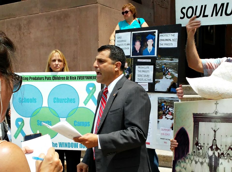 State Rep. Mark Rozzi, alongside sex abuse survivors and victim-rights advocates, holds a press conference outside the Cathedral Basilica of Sts. Peter and Paul in Philadelphia in July 2016. (NCR photo/Elizabeth Eisenstadt Evans)