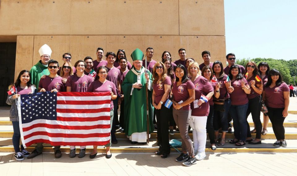 Los Angeles Archbishop José Gomez, center, and Auxiliary Bishop Robert Barron pose for a photo at the Cathedral of Our Lady of the Angels with a group of World Youth Day pilgrims who received a send-off blessing July 17, 2016. (CNS/Victor Aleman) Los Angeles Archbishop José Gomez, center, and Auxiliary Bishop Robert Barron pose for a photo at the Cathedral of Our Lady of the Angels with a group of World Youth Day pilgrims who received a send-off blessing July 17, 2016. (CNS/Victor Aleman)