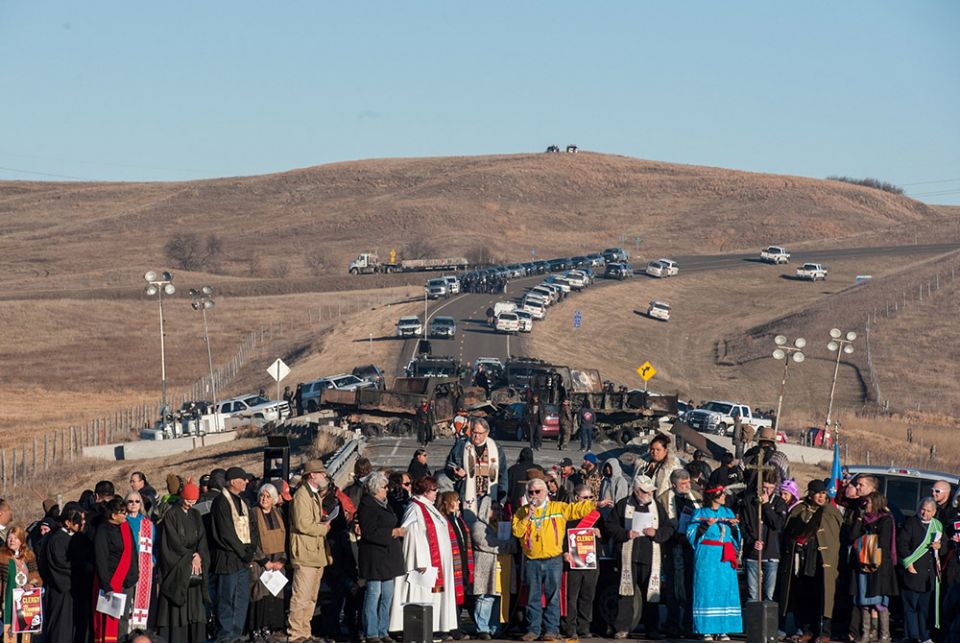 Clergy of many faiths from across the United States participate in a prayer circle Nov. 3, 2016, in front of a bridge in Standing Rock, North Dakota, where demonstrators confront police during a protest of the Dakota Access pipeline. (CNS/Reuters/Stephani