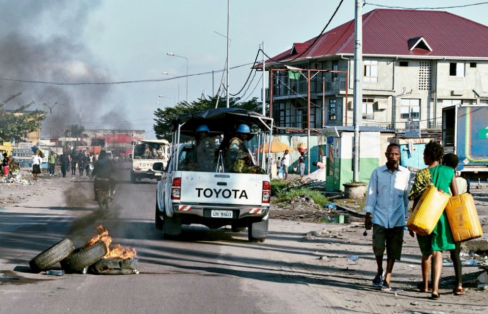 Peacekeepers drive past burning tires as they patrol protests against President Joseph Kabila in Kinshasa, Congo, April 10, 2017. (CNS/Reuters/Robert Carrubba) Peacekeepers drive past burning tires as they patrol protests against President Joseph Kabila in Kinshasa, Congo, April 10, 2017. (CNS/Reuters/Robert Carrubba)