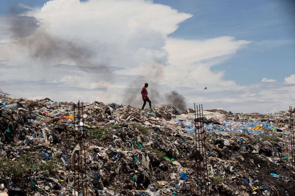 A man walks in a garbage dump in Kisumu, Kenya, April 18. (CNS/Baz Ratner, Reuters) A man walks in a garbage dump in Kisumu, Kenya, April 18. (CNS/Baz Ratner, Reuters)