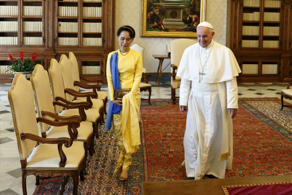 Pope Francis walks with Aung San Suu Kyi during a private audience at the Vatican May 4. (CNS/Paul Haring) 