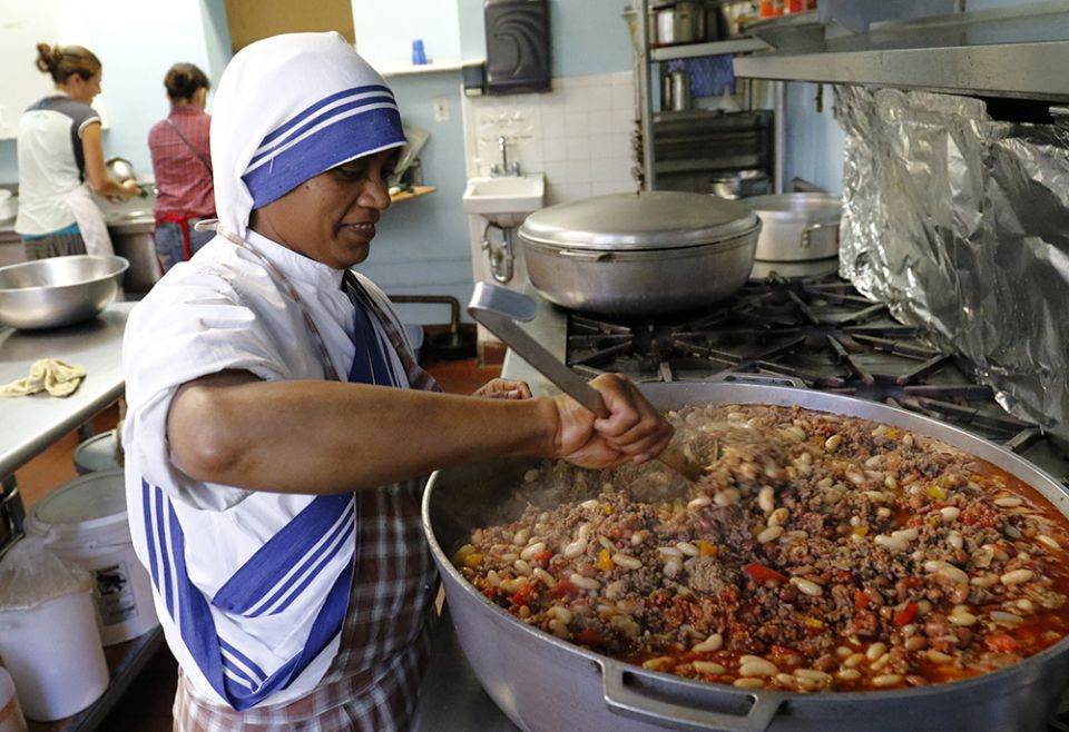 Sr. Marie Frank, a member of the Missionaries of Charity, prepares lunch in a soup kitchen run by her order in an apartment building in the South Bronx section of New York in this 2016 photo. (CNS/Gregory A. Shemitz) 