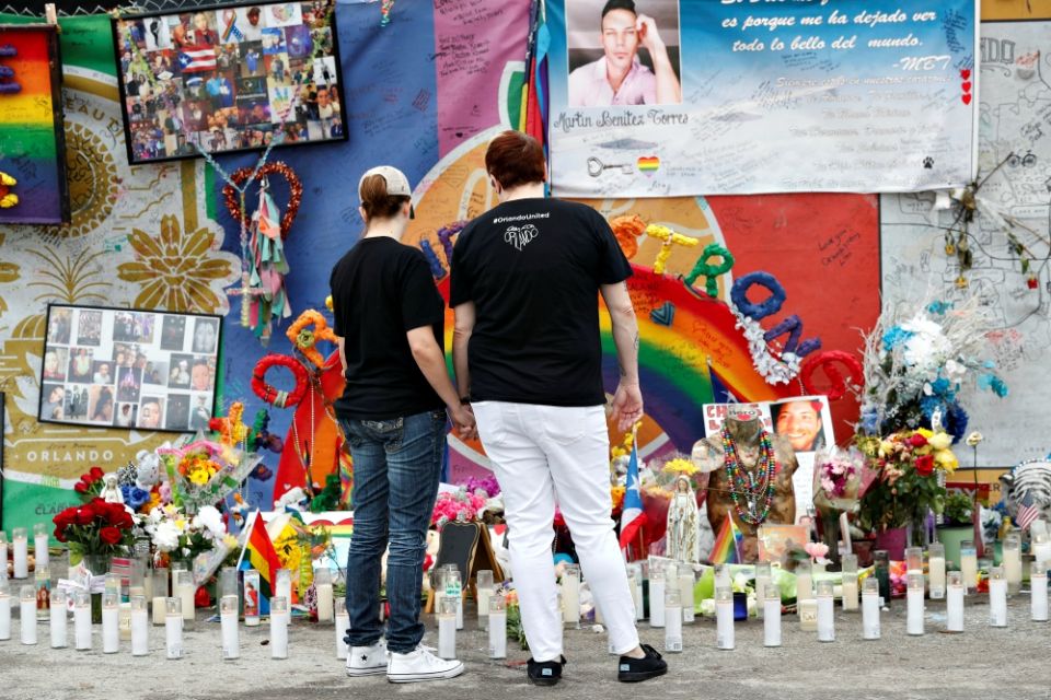 People visit the memorial outside the Pulse nightclub in Orlando, Florida, June 12, 2017, the one-year anniversary of the mass shooting there. (CNS/Reuters/Scott Audette) People visit the memorial outside the Pulse nightclub in Orlando, Florida, June 12, 2017, the one-year anniversary of the mass shooting there. (CNS/Reuters/Scott Audette)