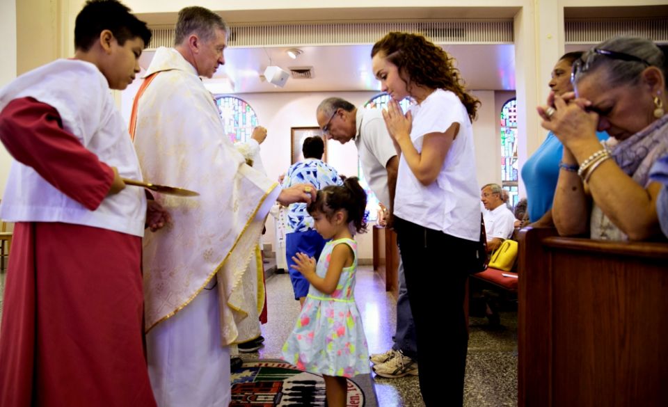 Chicago Cardinal Blase Cupich gives Communion during Mass at Sacred Heart Church in McAllen, Texas, Aug. 15. (CNS/Courtesy of Catholic Extension) Chicago Cardinal Blase Cupich gives Communion during Mass at Sacred Heart Church in McAllen, Texas, Aug. 15. (CNS/Courtesy of Catholic Extension)