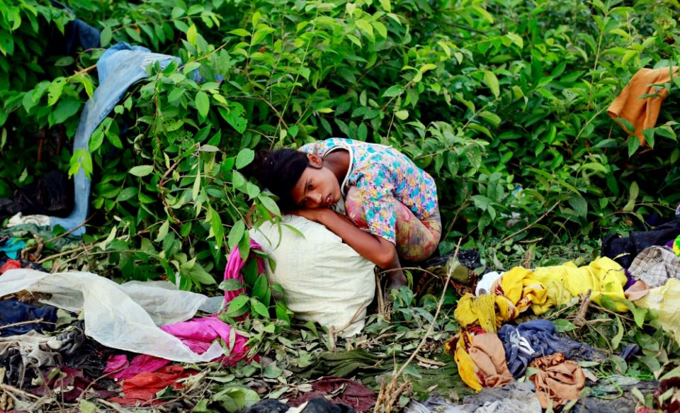 A Rohingya refugee girl rests after arriving Sept. 14 at a makeshift refugee camp in Cox's Bazar, Bangladesh. (CNS/Reuters/Danish Siddiqui) A Rohingya refugee girl rests after arriving Sept. 14 at a makeshift refugee camp in Cox's Bazar, Bangladesh. (CNS/Reuters/Danish Siddiqui)