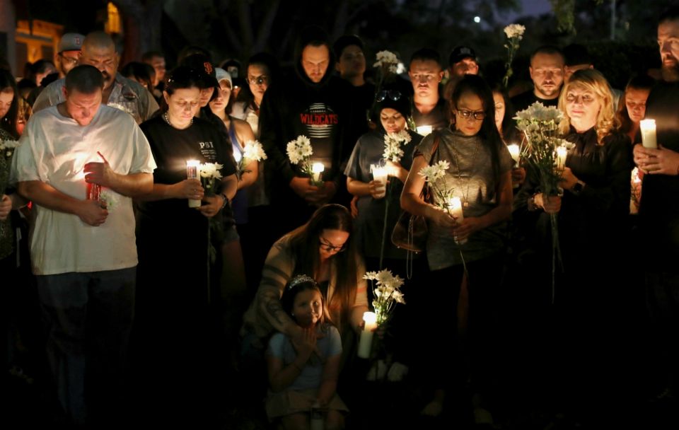 People attend a candlelight vigil Oct. 3 in memory of the victims of a mass shooting along the Las Vegas Strip. (CNS/Reuters/Mike Blake) People attend a candlelight vigil Oct. 3 in memory of the victims of a mass shooting along the Las Vegas Strip. (CNS/Reuters/Mike Blake)