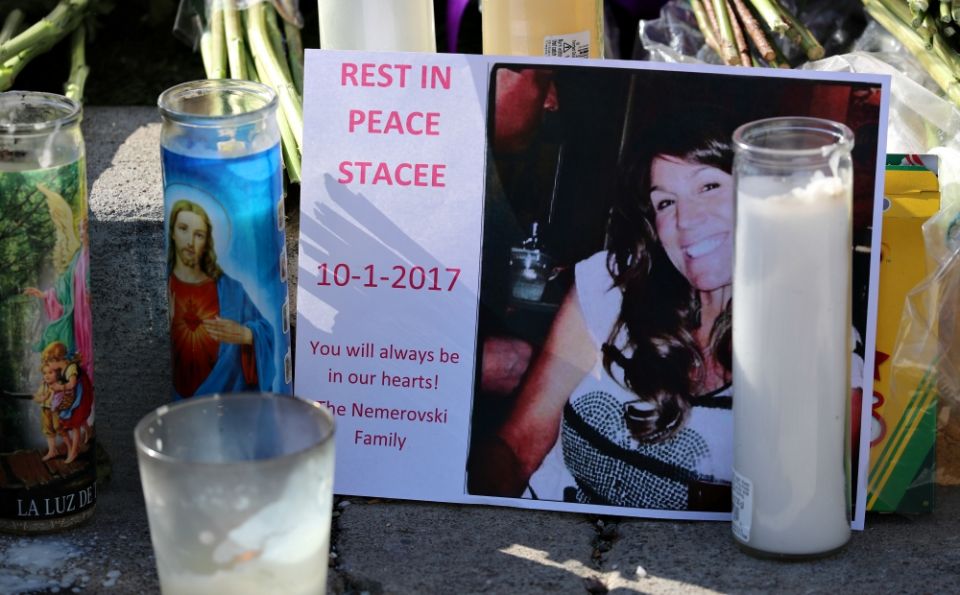 At a makeshift memorial along the Las Vegas Strip Oct. 4, candles surround a photo of one of the victims of the Oct. 1 mass shooting in Las Vegas. (CNS/Reuters/Mike Blake)