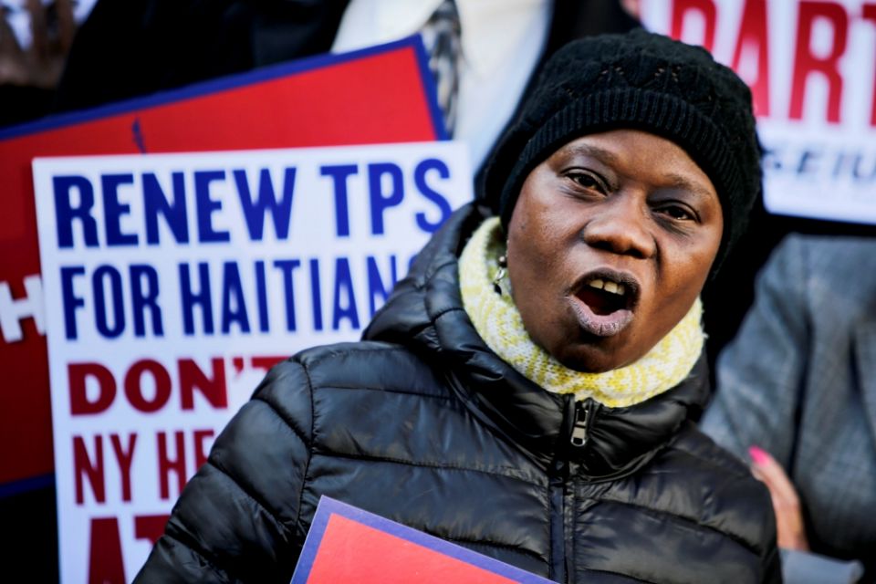A woman participates in an immigration rally for Haitians Nov. 21 in New York City. (CNS/Reuters/Eduardo Munoz) A woman participates in an immigration rally for Haitians Nov. 21 in New York City. (CNS/Reuters/Eduardo Munoz)