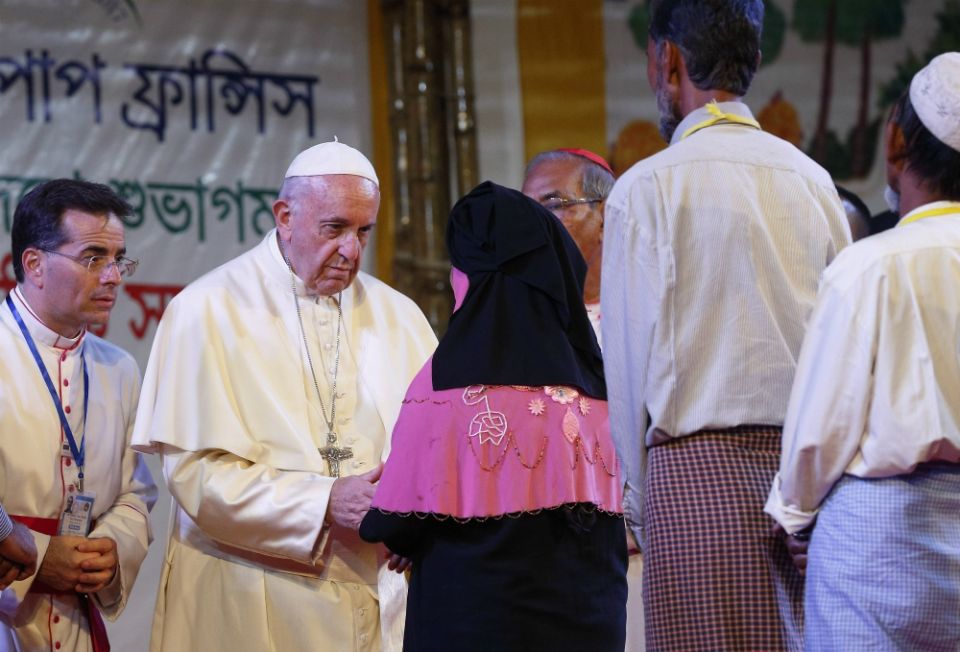 Pope Francis meets Rohingya refugees from Myanmar during an interreligious and ecumenical meeting for peace in the garden of the archbishop's residence in Dhaka, Bangladesh, Dec. 1. (CNS/Paul Haring)