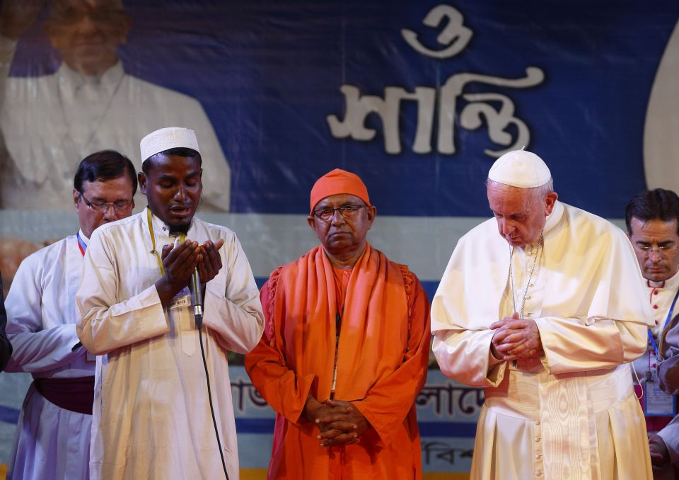 Pope Francis prays with religious leaders after meeting Rohingya refugees from Myanmar during an interreligious and ecumenical meeting for peace in the garden of the archbishop's residence in Dhaka, Bangladesh, Dec. 1. (CNS/Paul Haring) Pope Francis prays with religious leaders after meeting Rohingya refugees from Myanmar during an interreligious and ecumenical meeting for peace in the garden of the archbishop's residence in Dhaka, Bangladesh, Dec. 1. (CNS/Paul Haring)