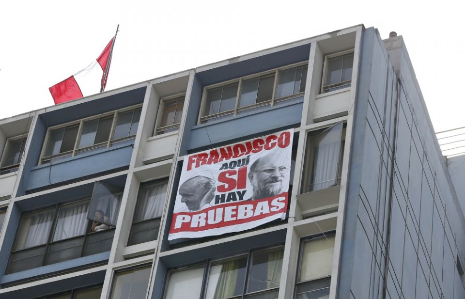 A protest banner that says in Spanish, "Yes, Francis, here there is proof," hangs outside the cathedral in Lima, Peru, Jan. 21. The banner protests Pope Francis' defense of Bishop Juan Barros of Osorno, Chile. (CNS/Paul Haring) A protest banner that says in Spanish, "Yes, Francis, here there is proof," hangs outside the cathedral in Lima, Peru, Jan. 21. The banner protests Pope Francis' defense of Bishop Juan Barros of Osorno, Chile. (CNS/Paul Haring)