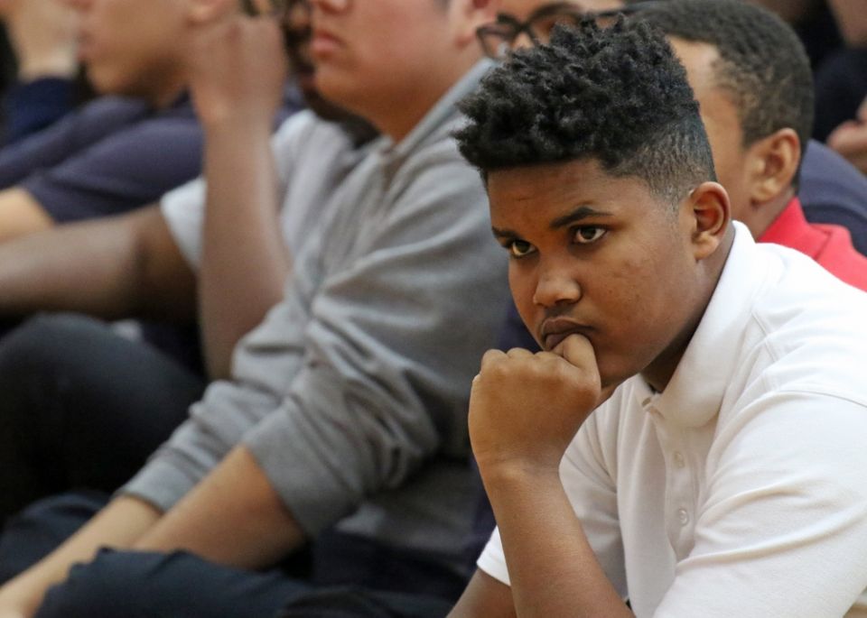 Student Matthew McIntosh listens to a speaker during a solidarity and remembrance service at St. Francis Preparatory School in the Queens borough of New York March 14. (CNS/Gregory A. Shemitz)