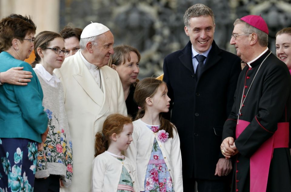 Pope Francis talks with Dublin Archbishop Diarmuid Martin as he meets an Irish delegation of families during his general audience in St. Peter's Square at the Vatican March 21. (CNS/Paul Haring)