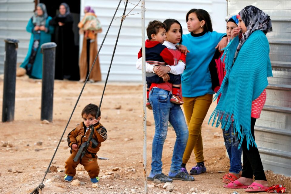 Syrian refugees wait outside their shelters in January 2018 at Zaatari camp near Mafraq, Jordan. (CNS/Reuters/Muhammad Hamed) Syrian refugees wait outside their shelters in January 2018 at Zaatari camp near Mafraq, Jordan. (CNS/Reuters/Muhammad Hamed)