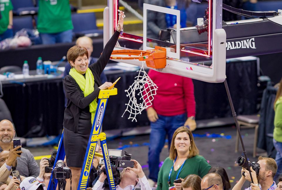Muffet McGraw, head coach of the Notre Dame women's basketball team, cuts the net after her players defeated Mississippi State 61-58 April 1, 2018, in the championship game of the Final Four of the NCAA Tournament in Columbus, Ohio. (CNS) Muffet McGraw, head coach of the Notre Dame women's basketball team, cuts the net after her players defeated Mississippi State 61-58 April 1, 2018, in the championship game of the Final Four of the NCAA Tournament in Columbus, Ohio. (CNS)