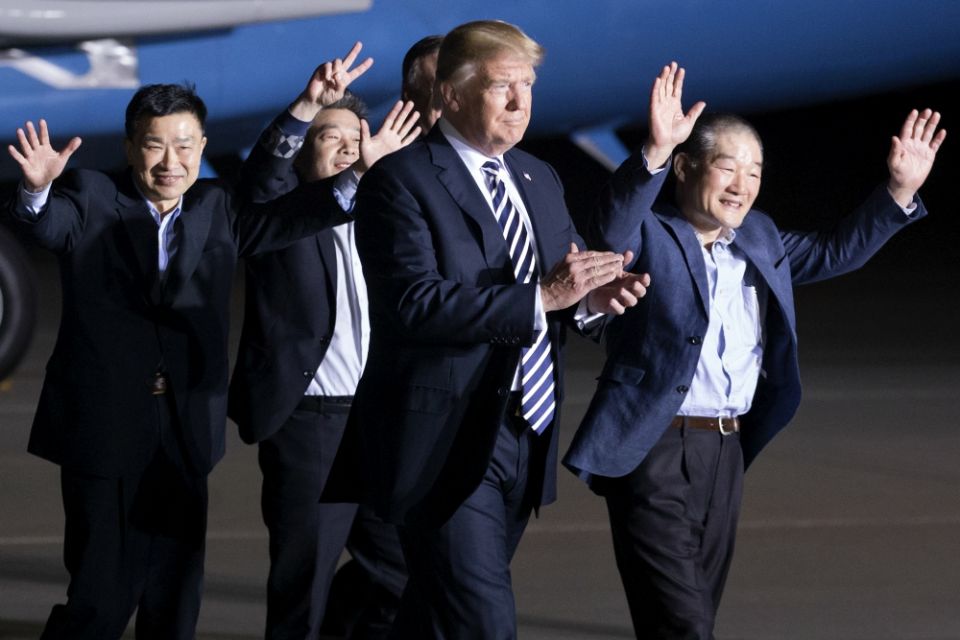 President Donald Trump walks with three U.S. detainees arriving May 10 at Joint Base Andrews, Maryland, after they were released by North Korea as a goodwill gesture. (CNS/EPA/Michael Reynolds) President Donald Trump walks with three U.S. detainees arriving May 10 at Joint Base Andrews, Maryland, after they were released by North Korea as a goodwill gesture. (CNS/EPA/Michael Reynolds)