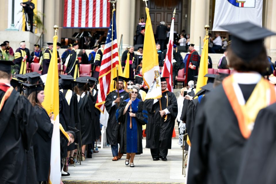 Students and faculty at the Catholic University of America celebrate graduation May 12 in Washington. (CNS/The Catholic University of America/Dana Rene Bowler)