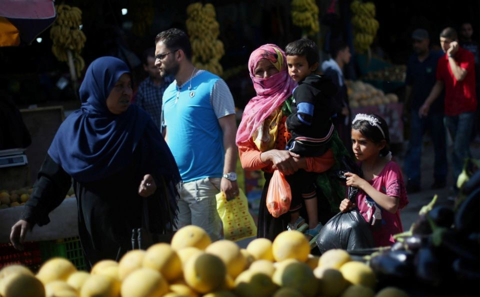 Palestinians shop at a market in the central Gaza Strip May 17. (CNS/Reuters/Ibraheem Abu Mustafa) Palestinians shop at a market in the central Gaza Strip May 17. (CNS/Reuters/Ibraheem Abu Mustafa)