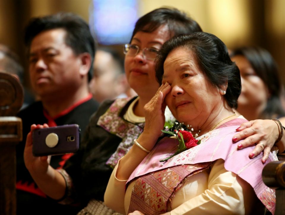 Blia Yang, mother of Fr. Toulee Peter Ly, wipes away a tear during his ordination Mass May 26 at the Cathedral of St. Paul in St. Paul, Minnesota. (CNS/The Catholic Spirit/Dave Hrbacek)