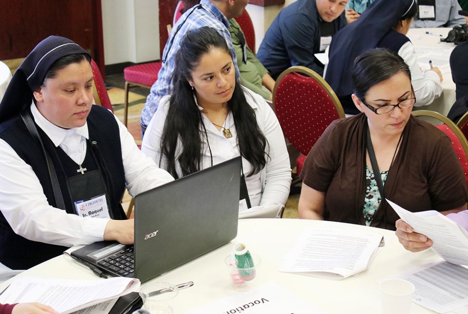 Sr. Raquel De Leon types notes as Victoria Rodriguez of the Diocese of Boise, Idaho, and Maria Elena Ruiz of the Archdiocese of Portland, Oregon, listen to speakers June 22, 2018, at the Region XII gathering of V Encuentro in Portland, Oregon. (CNS) Sr. Raquel De Leon types notes as Victoria Rodriguez of the Diocese of Boise, Idaho, and Maria Elena Ruiz of the Archdiocese of Portland, Oregon, listen to speakers June 22, 2018, at the Region XII gathering of V Encuentro in Portland, Oregon. (CNS)