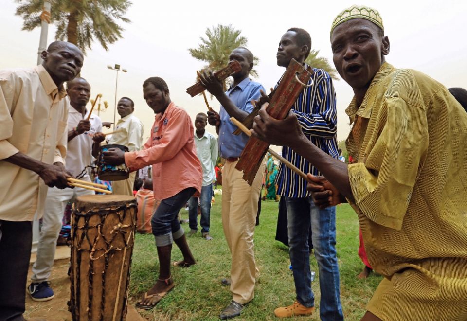 South Sudanese sing traditional songs June 25 in Khartoum during a South Sudan peace meeting as part of talks to negotiate an end to a civil war that broke out in 2013. (CNS/Reuters/Mohamed Nureldin Abdallah)