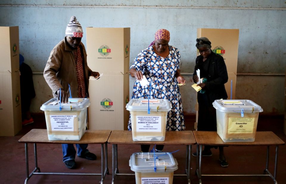 People cast their ballots in Zimbabwe's general elections July 30 in Harare. (CNS/Reuters/Siphiwe Sibeko)