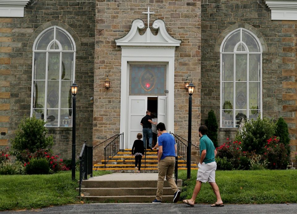 Massgoers enter Immaculate Heart of Mary Church Aug. 19 in Abbottstown, Pennsylvania, which is in the Diocese of Harrisburg. (CNS/Bob Roller)