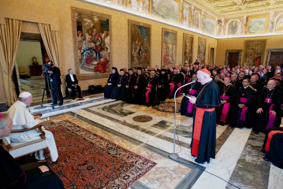 Pope Francis listens as Cardinal Marc Ouellet, prefect of the Congregation for Bishops, speaks during a meeting with recently appointed bishops from around the world at the Vatican Sept. 13. (CNS/Vatican Media)
