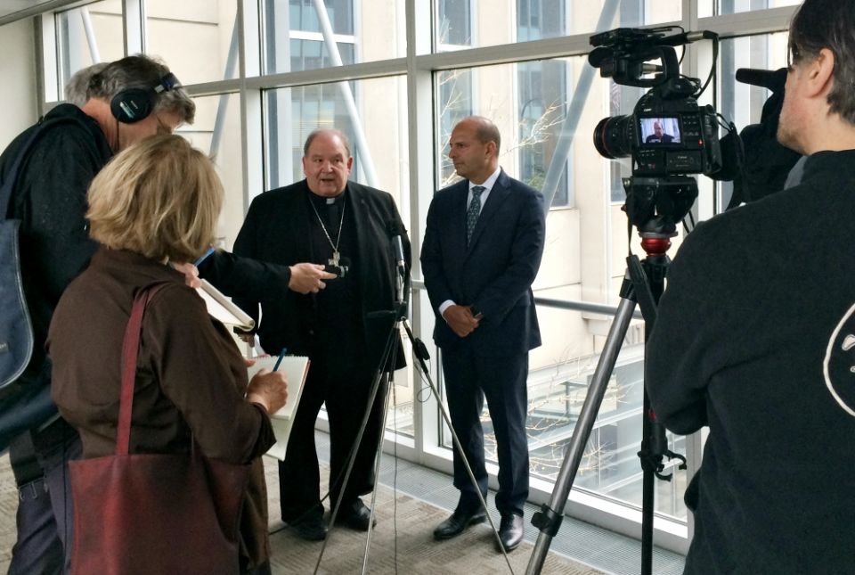 St. Paul-Minneapolis Archbishop Bernard Hebda speaks to the media alongside Thomas Abood, chairman of the archdiocese's finance council and reorganization task force, Sept. 25 at the U.S. Federal Courthouse in Minneapolis. (CNS/The Catholic Spirit)