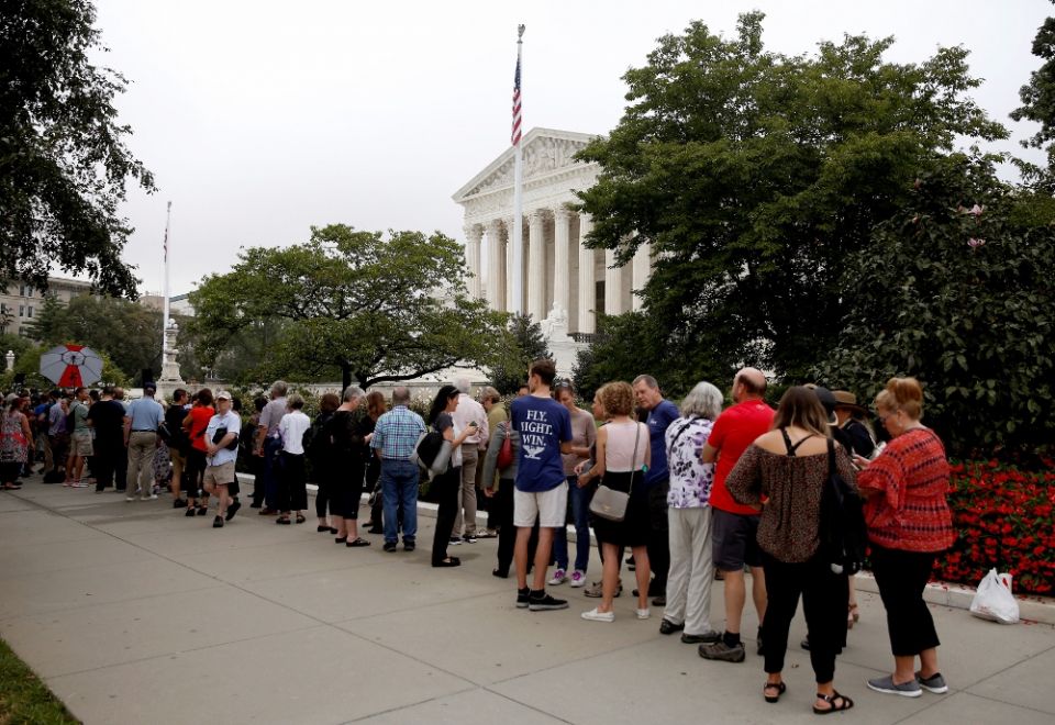 People wait in line to view court proceedings on the first day with newly sworn-in U.S. Supreme Court Justice Brett Kavanaugh Oct. 9 in Washington. (CNS/Reuters/Joshua Roberts)