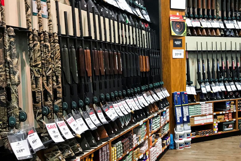 Rifles are seen inside the gun section of a sporting goods store. (CNS/Eduardo Munoz, Reuters)