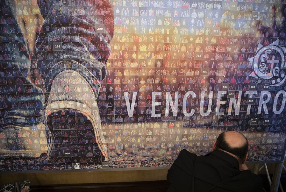 A delegate sticks a picture to a photo booth panel Sept. 22, 2018, during the Fifth National Encuentro in Grapevine, Texas. (CNS/Tyler Orsburn) A delegate sticks a picture to a photo booth panel Sept. 22, 2018, during the Fifth National Encuentro in Grapevine, Texas. (CNS/Tyler Orsburn)
