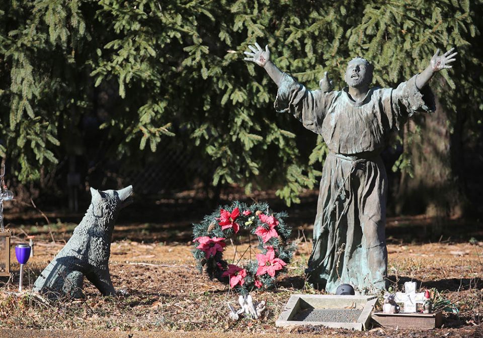A statue on the grounds of the National Shrine of St. Maximilian Kolbe, in Libertyville, Illinois, depicts St. Francis of Assisi taming the wolf of Gubbio. (CNS/Bob Roller) A statue on the grounds of the National Shrine of St. Maximilian Kolbe, in Libertyville, Illinois, depicts St. Francis of Assisi taming the wolf of Gubbio. (CNS/Bob Roller)
