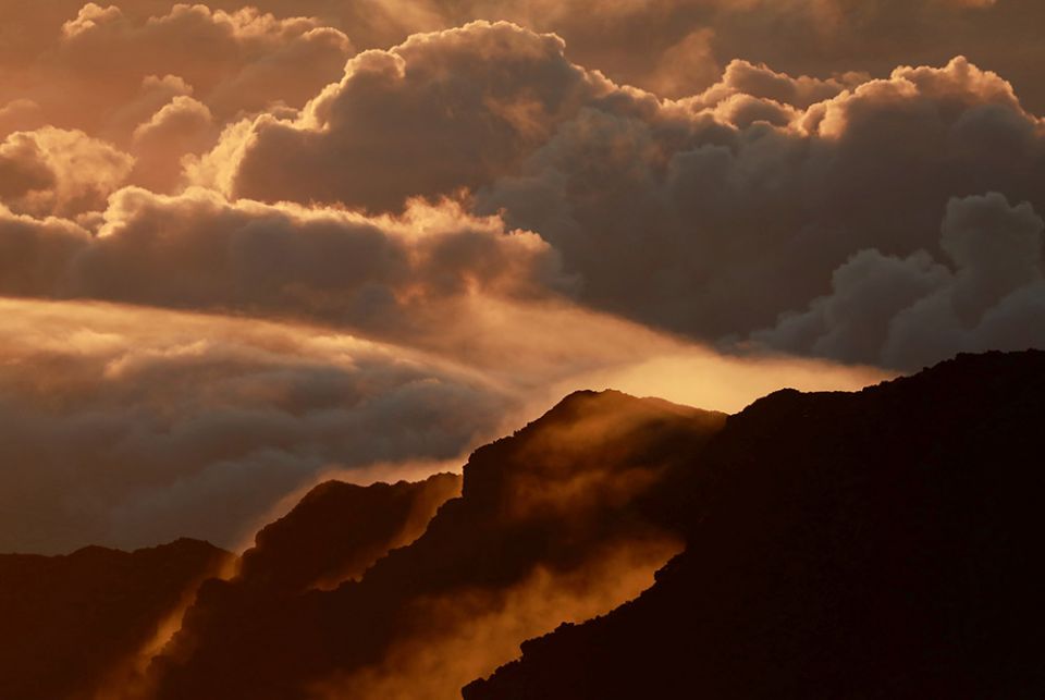Light illuminates a crater during the sunrise at Haleakala National Park on the Hawaiian island of Maui Oct. 9, 2018. (CNS/Navesh Chitrakar, Reuters) Light illuminates a crater during the sunrise at Haleakala National Park on the Hawaiian island of Maui Oct. 9, 2018. (CNS/Navesh Chitrakar, Reuters)