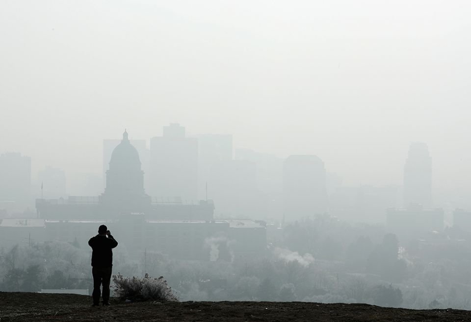 A man stops to take a picture of the Utah State Capitol and buildings that are shrouded in smog in downtown Salt Lake City Dec. 12, 2017. (CNS/Reuters/George Frey) A man stops to take a picture of the Utah State Capitol and buildings that are shrouded in smog in downtown Salt Lake City Dec. 12, 2017. (CNS/Reuters/George Frey)