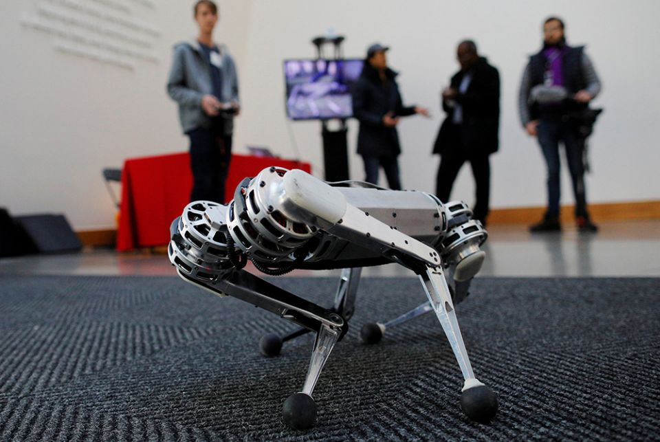 Students demonstrate the Mini Cheetah, a quadruped robot, during presentations at the Massachusetts Institute of Technology Feb. 26, 2019, in Cambridge. In his book "Robots, Ethics and the Future of Jobs," Fr. Seán McDonagh predicts that millions of jobs Students demonstrate the Mini Cheetah, a quadruped robot, during presentations at the Massachusetts Institute of Technology Feb. 26, 2019, in Cambridge. In his book "Robots, Ethics and the Future of Jobs," Fr. Seán McDonagh predicts that millions of jobs