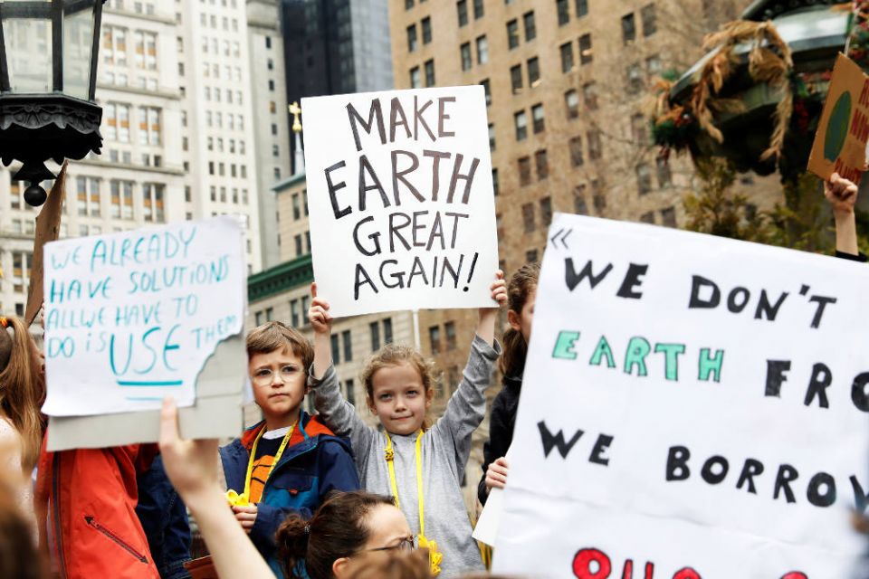 Students hold signs in New York City March 15, 2019, to demand action on climate change. Students from around the world are participating in the "strike." (CNS photo/Shannon Stapleton, Reuters)