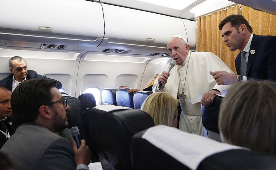 Pope Francis responds to a question from Joshua McElwee of the National Catholic Reporter aboard the papal plane from Skopje, North Macedonia, to Rome May 7, 2019. (CNS/Paul Haring)