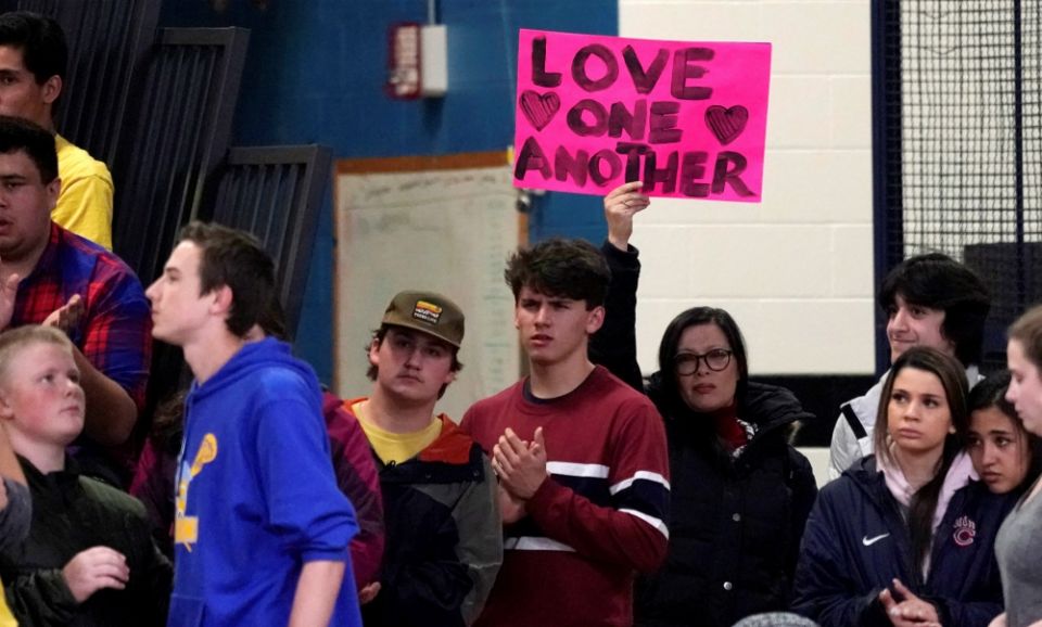 A woman displays a sign during a vigil May 8 for victims of a shooting the day before at the STEM School Highlands Ranch in Colorado. (CNS/Reuters/Rick Wilking) A woman displays a sign during a vigil May 8 for victims of a shooting the day before at the STEM School Highlands Ranch in Colorado. (CNS/Reuters/Rick Wilking)