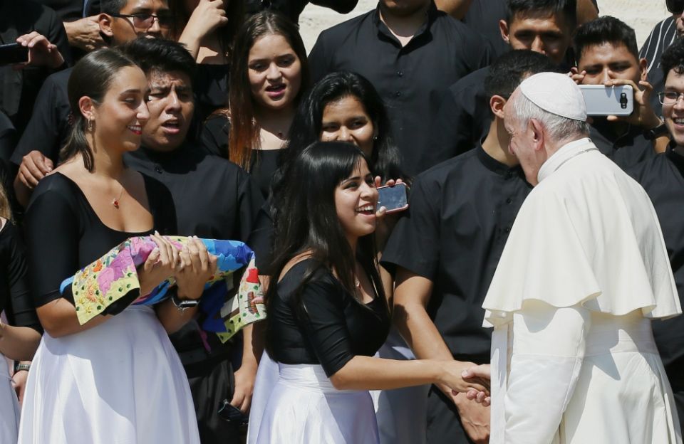Pope Francis greets women during his general audience in St. Peter's Square at the Vatican June 26. (CNS/Paul Haring) 