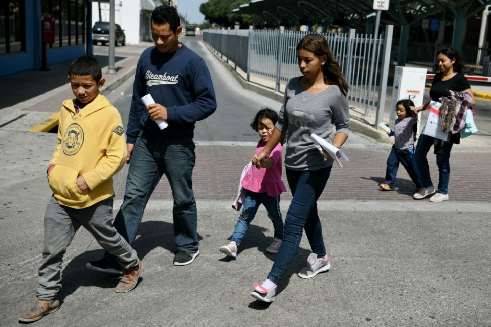 Migrant families seeking asylum walk from a bus depot to a Catholic Charities humanitarian respite center just after being released from federal detention in McAllen, Texas, July 31. (CNS/Reuters/Loren Elliott) Migrant families seeking asylum walk from a bus depot to a Catholic Charities humanitarian respite center just after being released from federal detention in McAllen, Texas, July 31. (CNS/Reuters/Loren Elliott)