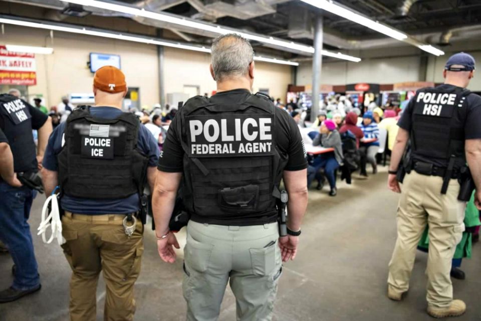 U.S. Immigration and Customs Enforcement officers look on after executing search warrants and making arrests Aug. 7 at an agricultural processing facility in Canton, Mississippi. (CNS/Immigration and Customs Enforcement handout via Reuters) U.S. Immigration and Customs Enforcement officers look on after executing search warrants and making arrests Aug. 7 at an agricultural processing facility in Canton, Mississippi. (CNS/Immigration and Customs Enforcement handout via Reuters)